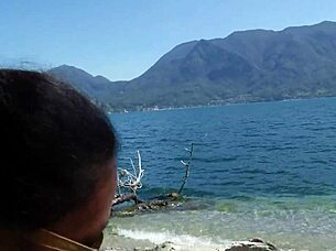 Slutty wife enjoys public beach pleasure with weights and gets a tan while being watched.