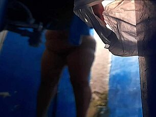 A well-endowed stepmother enjoys shower time and pleasuring herself