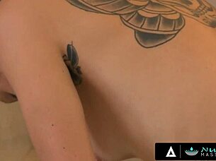 A sexy massage with oil with a erotic twist: a tattooed masseuse giving a deepthroat blowjob.