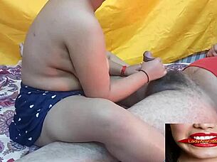 Big-boobed Indian girlfriend gives footjob outdoors