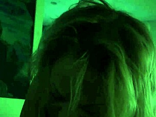 A beautiful woman gives a blowjob in a hotel room