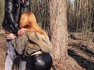 Redhead babe gets fucked in the woods openly