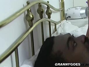 A mature and curvaceous woman gives a deep blow job to a well-endowed black man