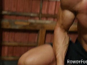 Muscular hunk gets a gay anal creampie in this bareback video