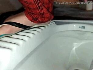 Indian wife pees and pleases herself in the bathroom