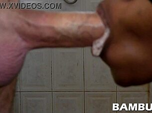 A black girl gives a deep blow job to a white man and gets him to cum in her mouth