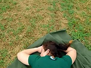 Pretty and curvaceous woman shows off her assets in a thong bodysuit during a camping trip
