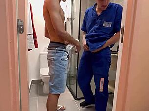 Steamy bathroom scene with a hung Brazilian gay giving a blow job to a big dick fetishist
