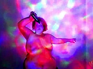 A plump redhead worship dance with oil and cloth stripping