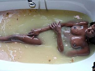 Ana Foxxx, tall black MILF model, strips and takes a relaxing bath