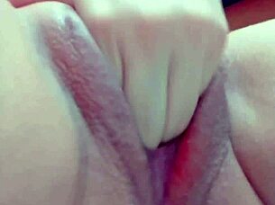 Close up of a homemade video of a woman fingering herself and having an orgasm