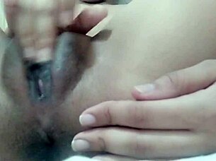 Close up of a naughty solo girl masturbating in the shower with a shaved pussy