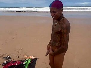 Beautiful woman having sex on the beach in front of everyone