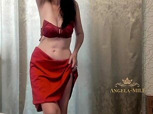Hot brunette MILF Angela undresses to music and wanks