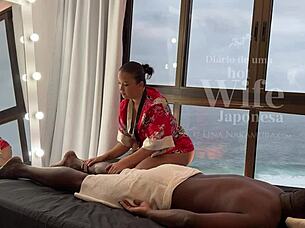 Asian masseuse gives a relaxing massage to a lucky man