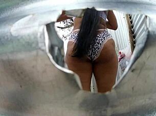 Mama law's big ass exposed by the beach dressing room cam