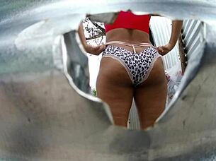Mama law's big ass exposed by the beach dressing room cam