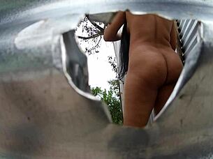 Mama law's big ass exposed by the beach dressing room cam