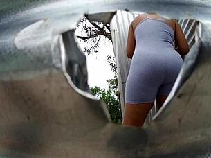 Mama law's big ass exposed by the beach dressing room cam
