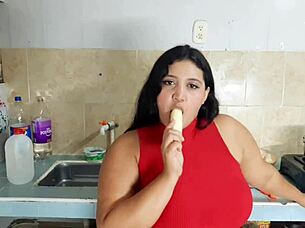 A black girl with an amazing set of large natural breasts has a rough and passionate experience with a young and inexperienced man in the kitchen