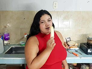 A black girl with an amazing set of large natural breasts has a rough and passionate experience with a young and inexperienced man in the kitchen