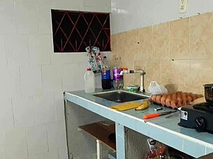 A black girl with an amazing set of large natural breasts has a rough and passionate experience with a young and inexperienced man in the kitchen
