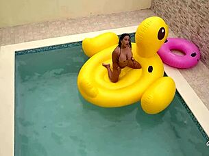 Maxine X plays with her pussy while sunbathing in the pool