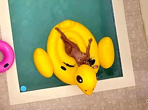 Maxine X plays with her pussy while sunbathing in the pool