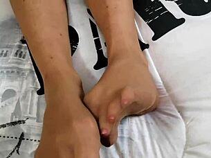 The slut in pantyhose teases and talks dirty with a purpose