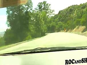 A hot chick is having fun while traveling in a car