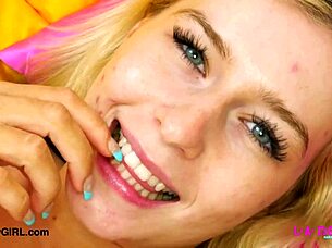 The cute blonde model proudly displays her stunning physique in this video