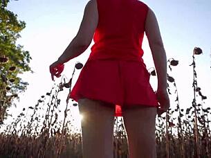 The hot mom in a short skirt is showing her ass in the yard