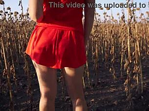 The hot mom in a short skirt is showing her ass in the yard