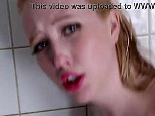 Green-eyed blonde washes away boredom in shower
