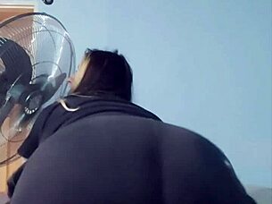 The full-size woman in short shorts is showing you her curves