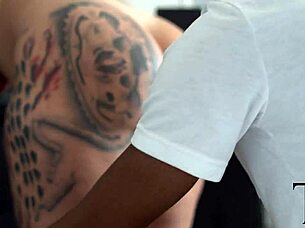 Tattooed blonde woman fucked by a black guy