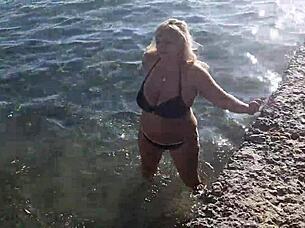 milf with big tits and fat ass gets wet playing on public beach