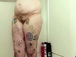 She gets soaking wet and soapy, letting her big natural tits and dripping pussy shine in homemade fun.