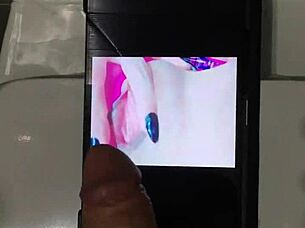 a petite 18+ amateur with big tits gives a horny handjob to a big cock, leading to a cumshot for her hot fan