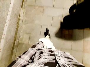 Chinese ladyboy in stockings and heels masturbates outdoors in boots.
