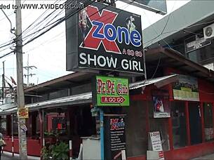 Asian tourist check out sex district in Thailand