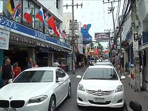 Asian tourist check out sex district in Thailand