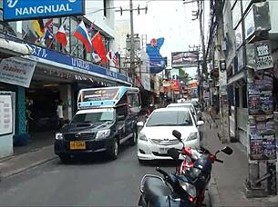 Asian tourist check out sex district in Thailand