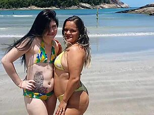 African amateur Branca de Neve and her little girlfriend stroll the beach in biquini