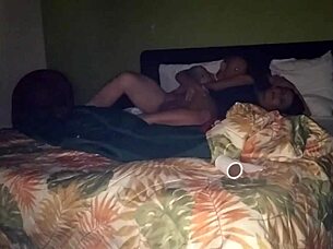 Two young adults engage into intimacy with a third person in the bedroom