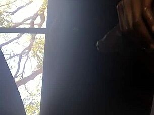 Ebony man wears ebony mask, masturbating, ejaculating