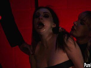 Mature woman penetrates young girl with a large black sex toy