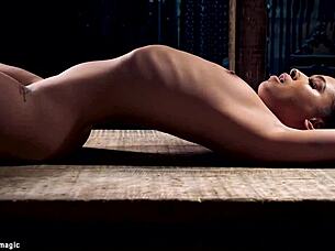BDSM scene showing brunette submissive restrained and penetrated