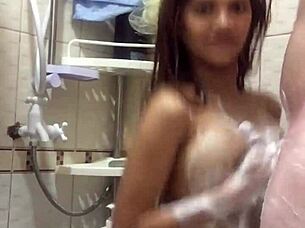 Asian babe gets wet in the shower