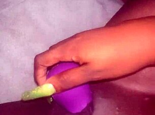 BW woman plays with a rose vibrator